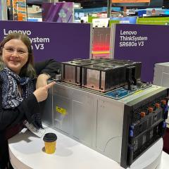 RCC's Sarah Walters at SC24 with Lenovo's ThinkSystem AMD MI300X 192GB 750W 8-GPU Board.