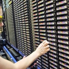 RCC's Shelly Harris installing tape cartridges at the Prentice Data Centre. (Photo: Owen Powell, RCC.)