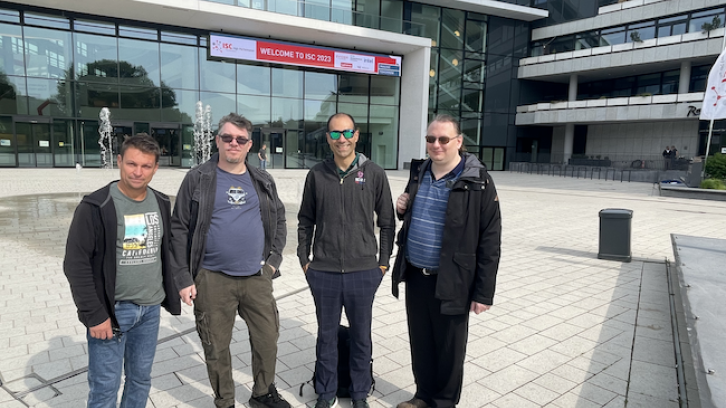 RCC's Jake Carroll (second from right) and Ashley Wright (far right) outside the ISC 2023 conference venue in Hamburg. With Jake and Ashley are David Cole (far left) from OneTeamIT and Andrew Beattie from IBM. Both David and Andrew are involved with UQ's research data storage infrastructure and the ARDC Nectar Research Cloud used by UQ researchers.