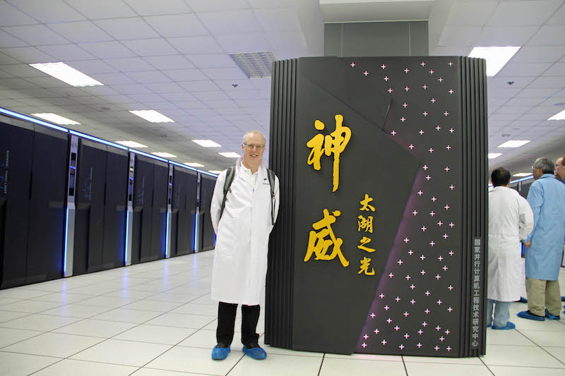 Prof. David Abramson with the fastest supercomputer in the world, the Sunway TauhuLight in Wuxi, China.